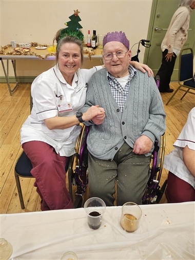 Carer and client at a Christmas party